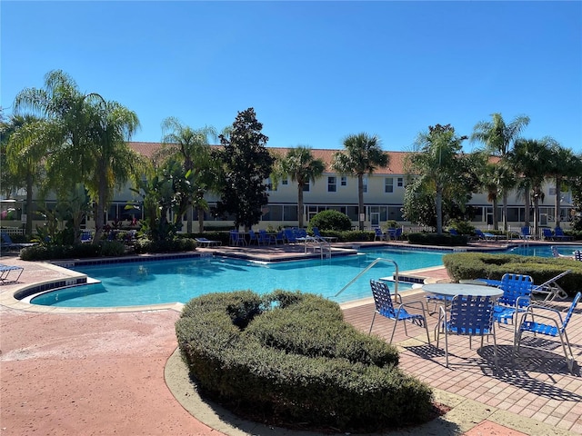 view of swimming pool with a patio