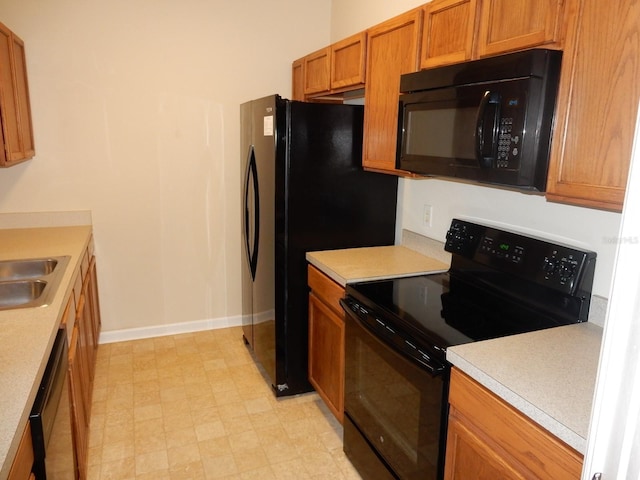 kitchen featuring black appliances and sink