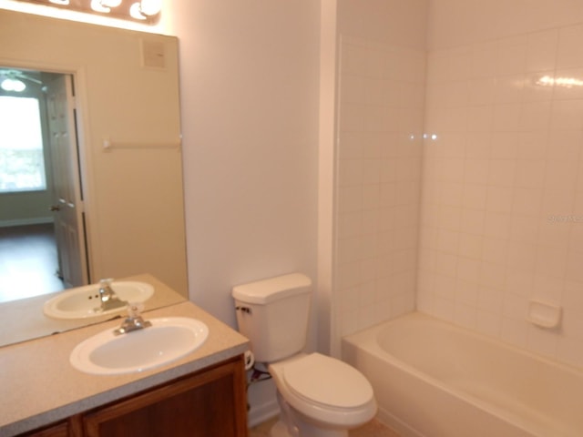 full bathroom with shower / tub combination, vanity, and toilet