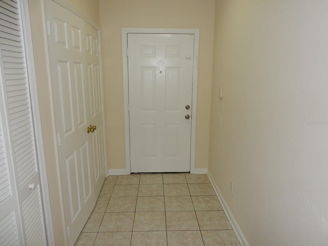 entryway featuring light tile patterned flooring