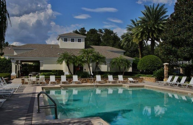 view of swimming pool with a patio