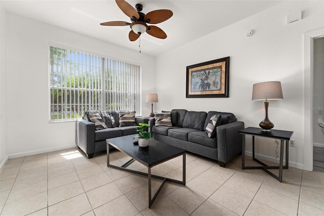 living room featuring light tile flooring and ceiling fan