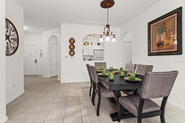 dining space with light tile floors