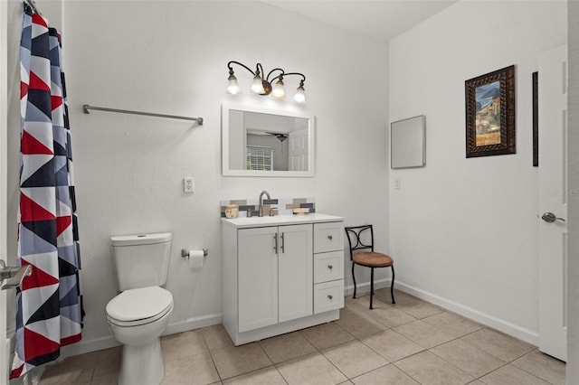 bathroom featuring tile floors, oversized vanity, and toilet