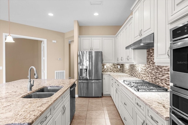 kitchen with white cabinetry, appliances with stainless steel finishes, sink, and pendant lighting