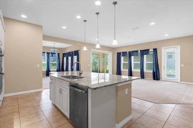 kitchen with white cabinetry, an island with sink, sink, stainless steel dishwasher, and light carpet