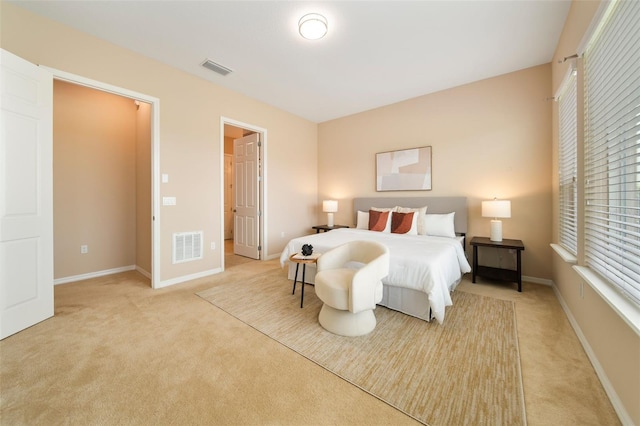 bedroom with light colored carpet