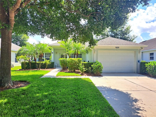 view of front facade with a garage and a front yard