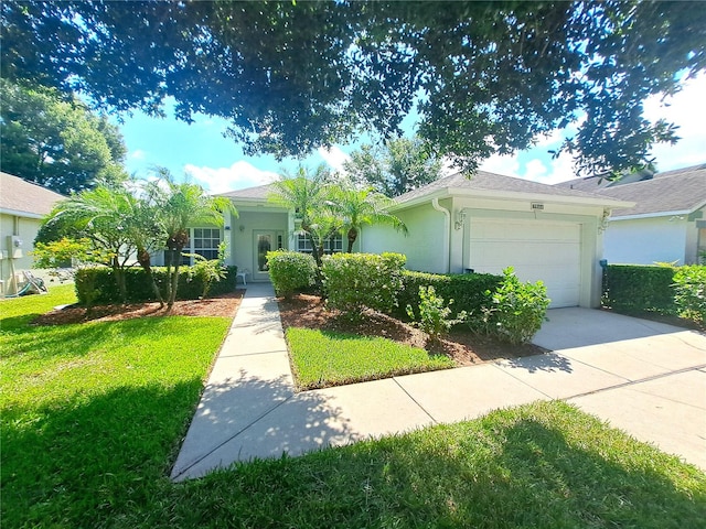 ranch-style house featuring a garage and a front lawn