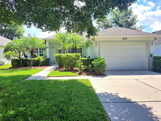 single story home with a front yard and a garage