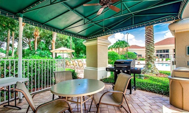 view of patio / terrace featuring ceiling fan