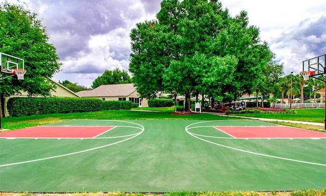 view of basketball court featuring a lawn