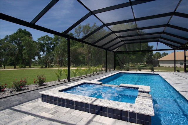 view of pool featuring an in ground hot tub, a lanai, a lawn, and a patio area