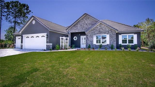 view of front facade featuring a garage and a front lawn