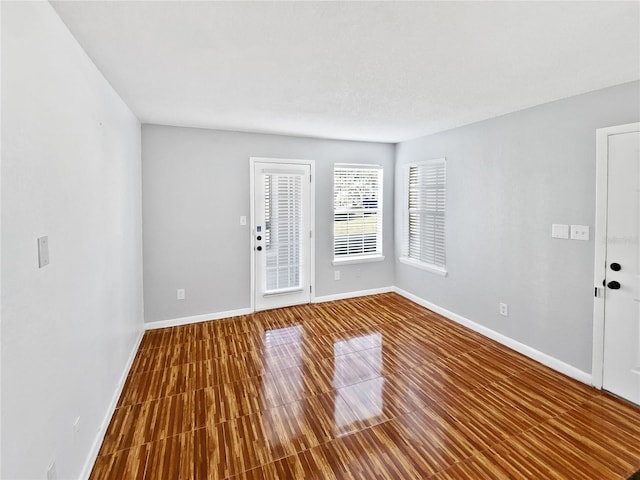 unfurnished room featuring wood-type flooring