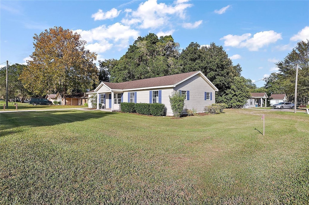 view of front of home with a front lawn