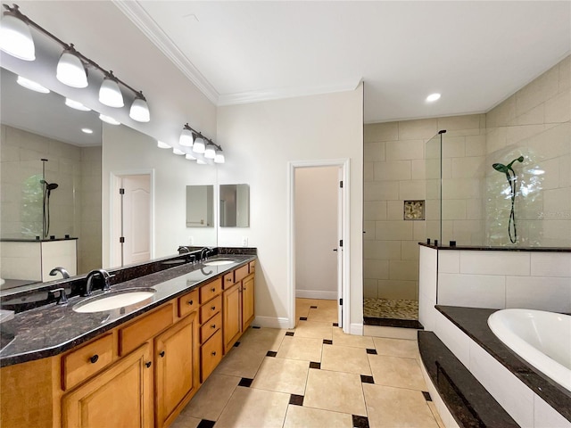 bathroom featuring tile patterned floors, vanity, ornamental molding, and shower with separate bathtub