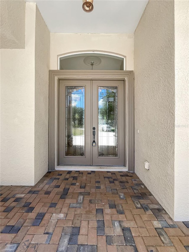 entrance to property featuring french doors