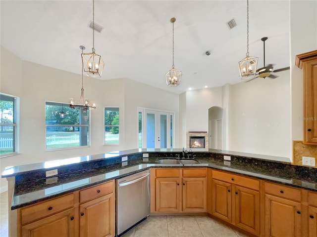 kitchen featuring dishwasher, hanging light fixtures, a healthy amount of sunlight, and sink