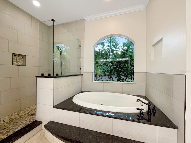 bathroom featuring tile patterned flooring, shower with separate bathtub, and crown molding