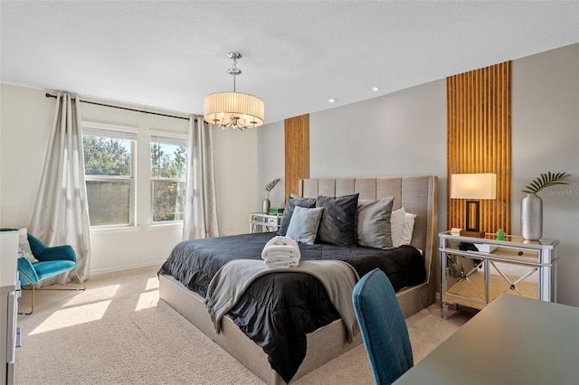 bedroom with recessed lighting, light carpet, baseboards, and an inviting chandelier