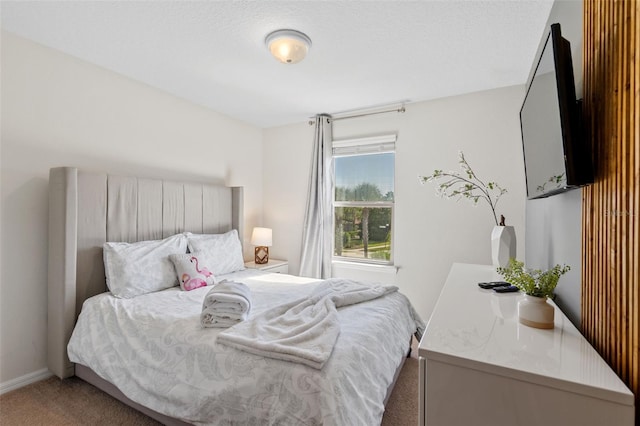 bedroom featuring carpet flooring and baseboards