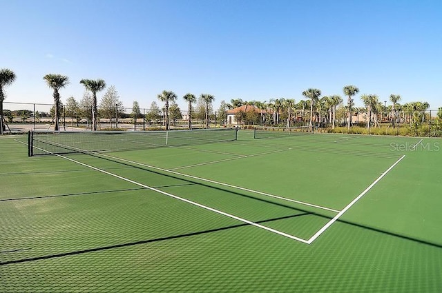 view of tennis court with fence