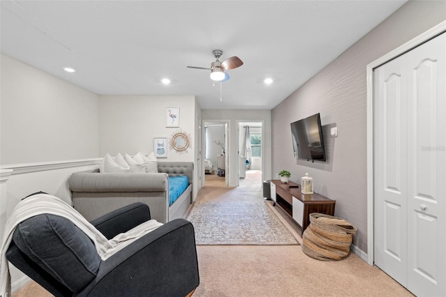 carpeted living area featuring recessed lighting and ceiling fan