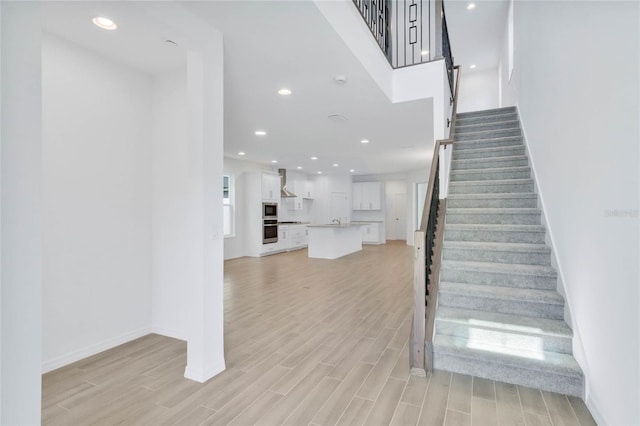 staircase featuring hardwood / wood-style floors