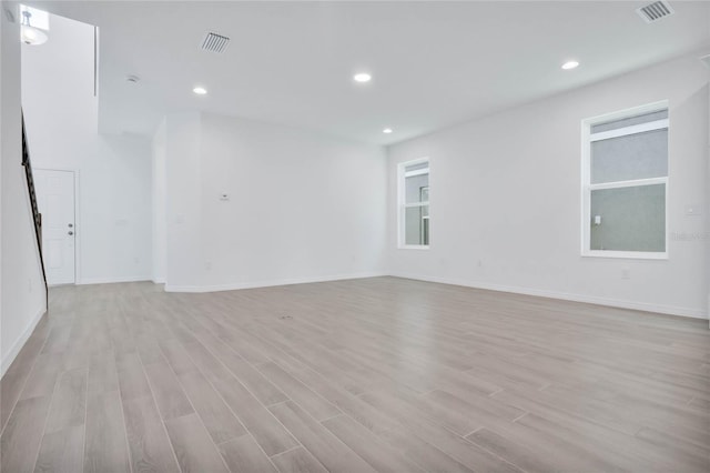 empty room with light hardwood / wood-style floors