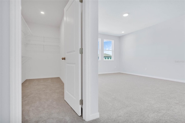 interior space featuring light colored carpet