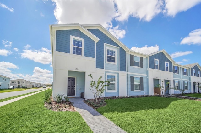 view of property featuring a front yard