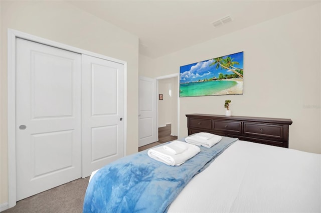 carpeted bedroom featuring a closet