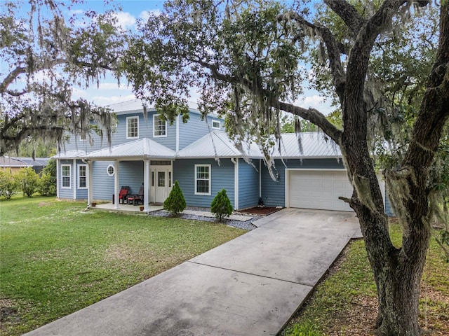 view of front facade with a front yard and a garage