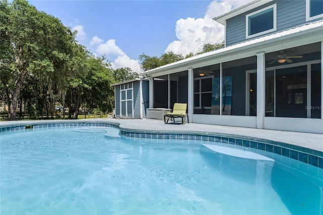 view of pool featuring ceiling fan and a sunroom