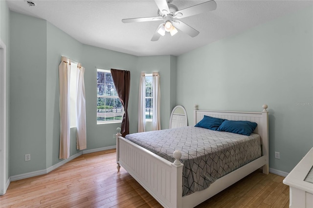 bedroom featuring ceiling fan and light hardwood / wood-style floors