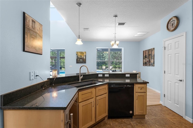 kitchen with dark stone counters, sink, hanging light fixtures, a textured ceiling, and black dishwasher