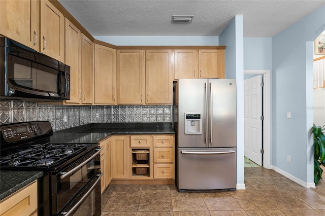 kitchen featuring backsplash, dark stone counters, a textured ceiling, black appliances, and tile patterned flooring