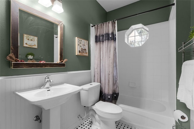 full bathroom with tile patterned floors, shower / bath combo, toilet, and sink