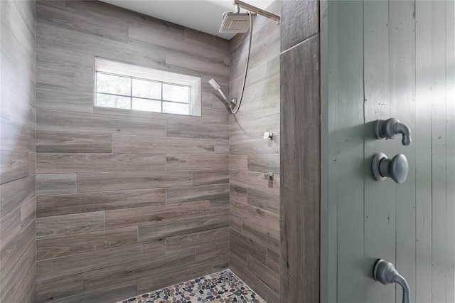 bathroom with wooden walls and tiled shower