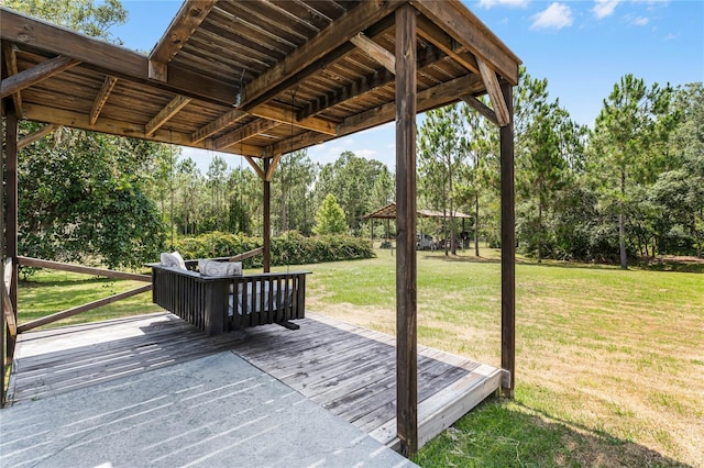 wooden deck featuring a yard