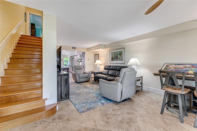 living room featuring ceiling fan