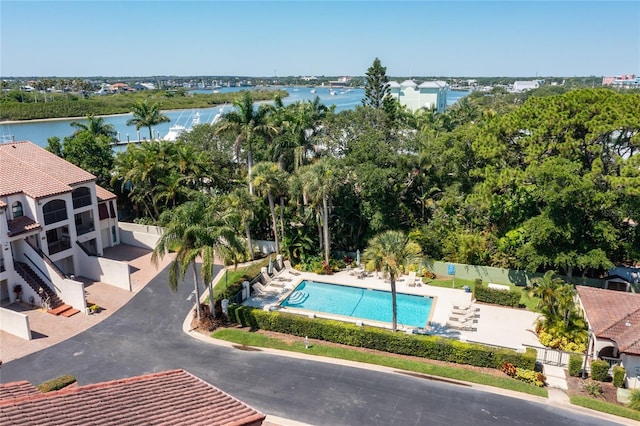 birds eye view of property with a water view