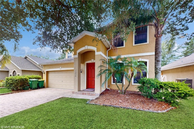 view of front of home with a garage and a front lawn