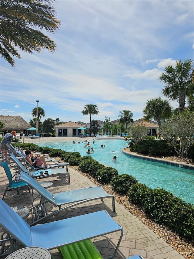 view of swimming pool with a patio