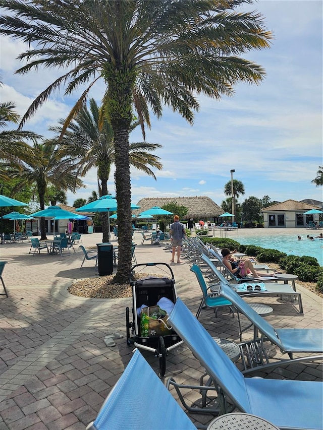 view of patio featuring a community pool