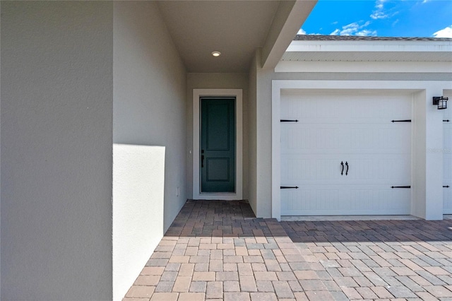 entrance to property featuring a garage