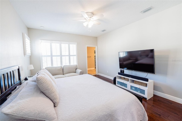 bedroom featuring dark hardwood / wood-style flooring and ceiling fan