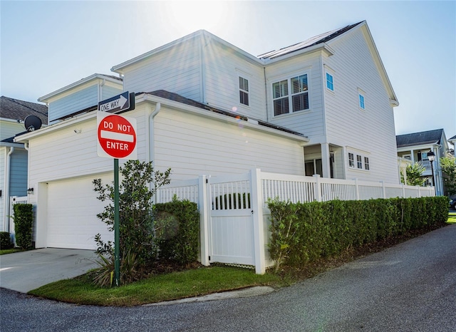 view of property exterior with a garage