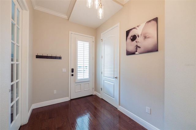 entrance foyer featuring dark hardwood / wood-style floors and ornamental molding